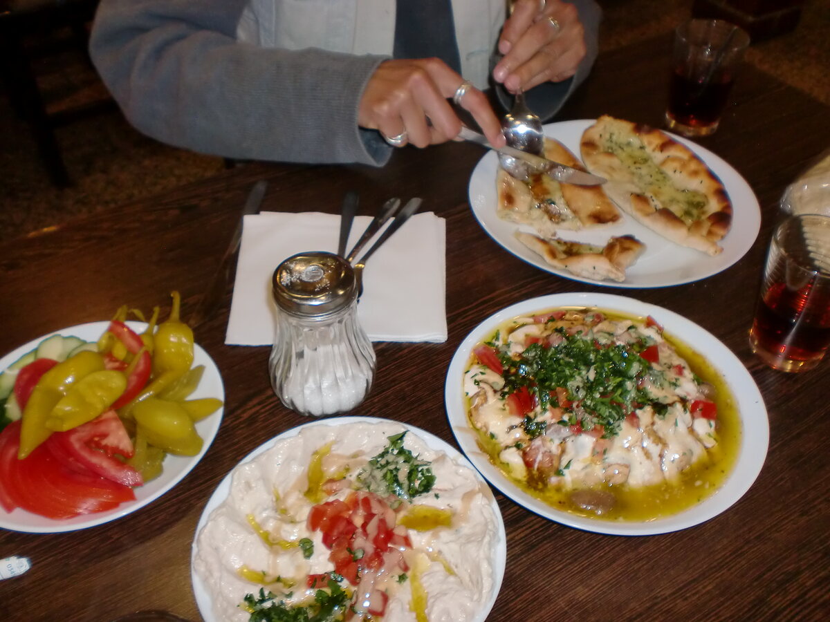 Table with multible plates of food